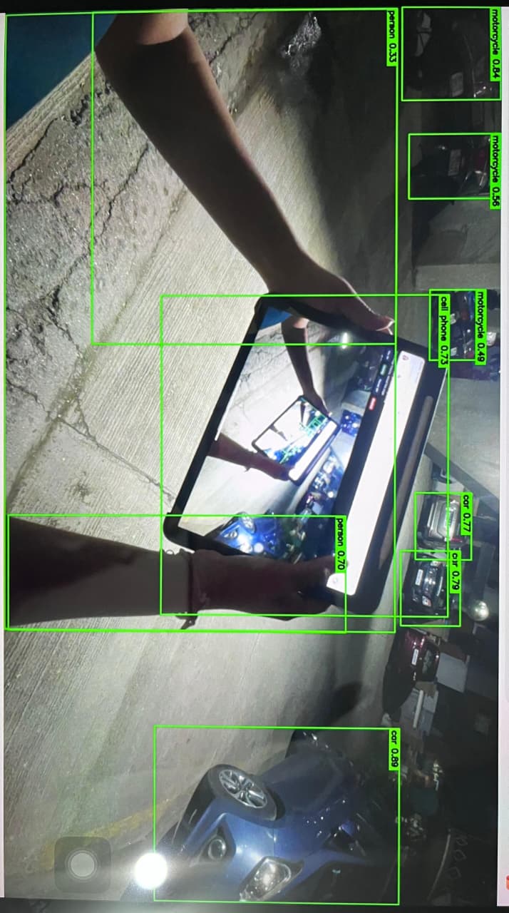 HAWKAI AI identifying a person holding a tablet and phone.